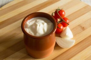 Melted sour cream is a sauce for Rakott Krumpli